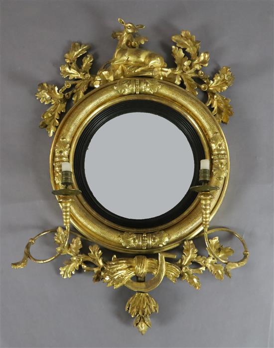 A Regency giltwood and gesso convex wall mirror, W.1ft 11in. H.2ft 7in.